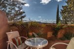 The patio is enchanting with privacy fencing and red rock views